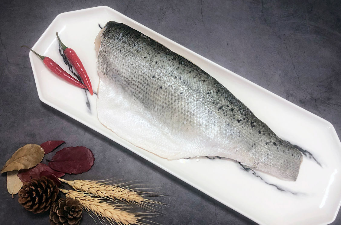 High-quality frozen seabass fillet processed by CHF Seafood, clean-cut and ready for cooking.